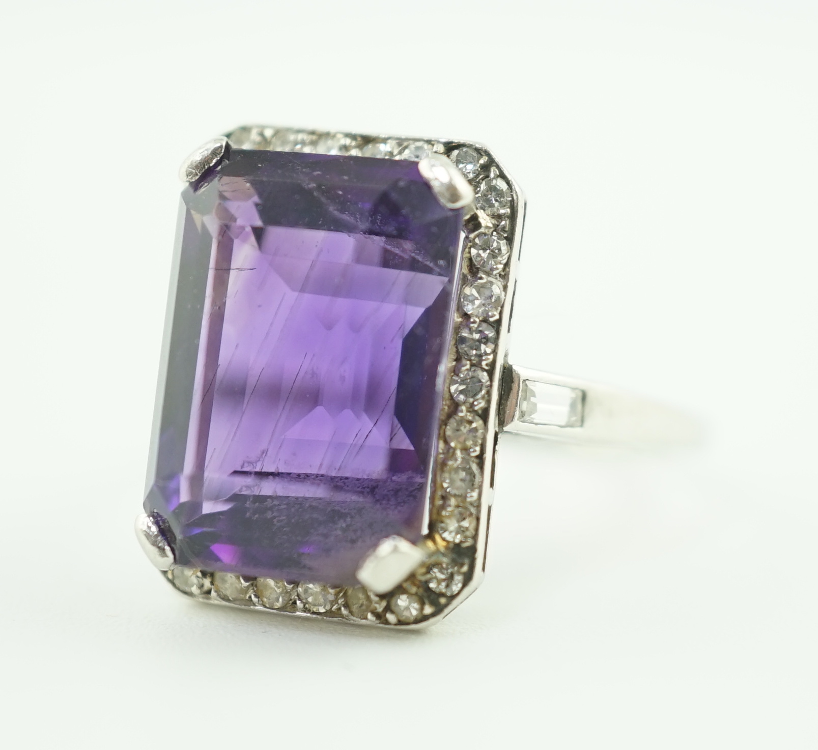A mid 20th century platinum?, amethyst and diamond set cluster ring